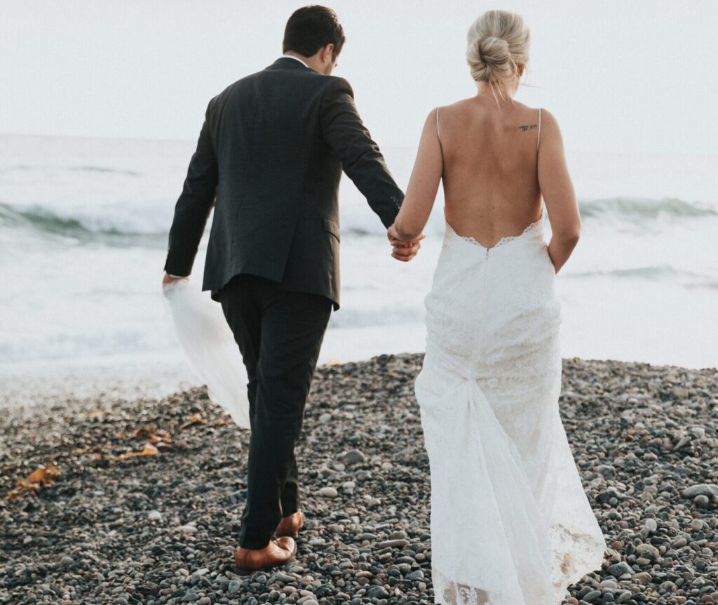 spray tan bride walking on the beach