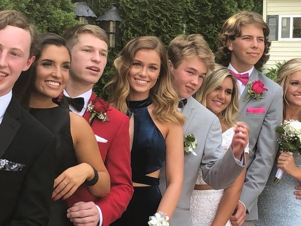 Group photo before prom of kids with spray tans